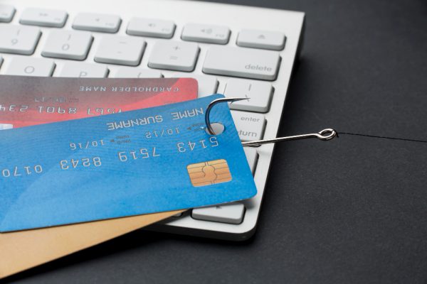 high-angle-keyboard-with-credit-cards-hook-phishing high-angle-keyboard-with-credit-cards-hook-phishing