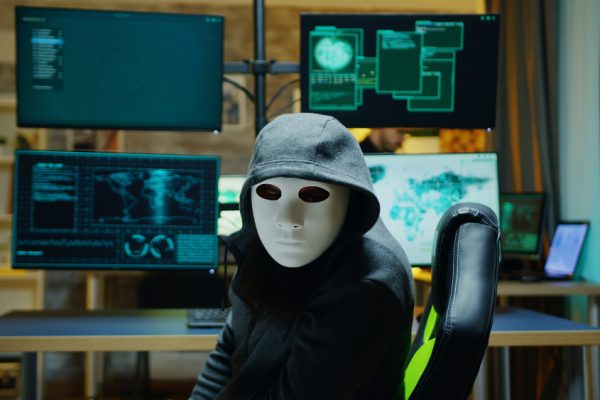 masked-hacker-wearing-hoodie-hide-his-identity-internet-criminal
